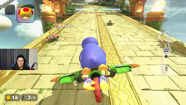 マリオカートワールドで青いキャラクターのみつおが石橋へグライダーで滑空する画面