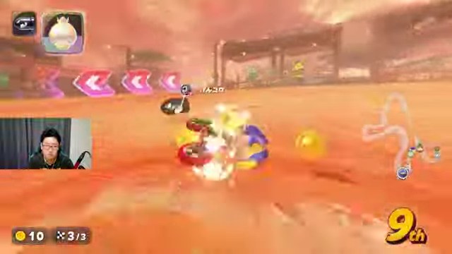 マリオカートワールドの砂地で参加者のカートと接触する場面