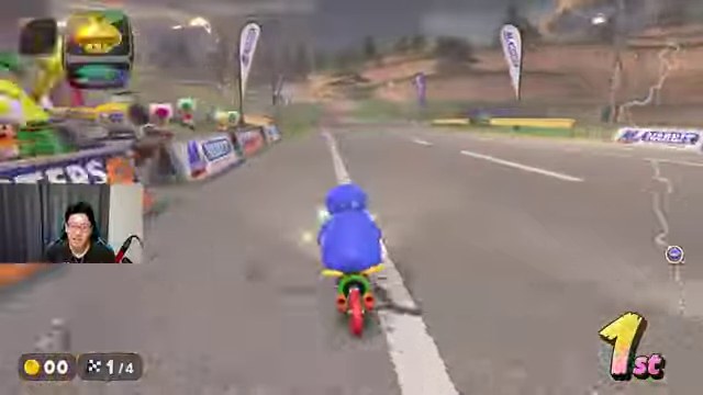 みつおのマリオカートワールド配信で青いレーサーが先頭を走り、右下に1stと表示された場面