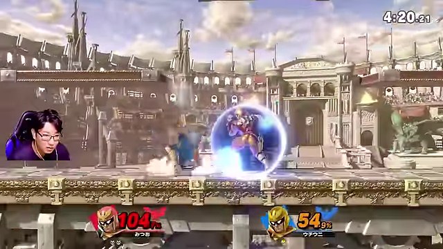 スマブラSPのファルコン同士の対戦で、ステージ中央に青いシールドを張る金色のファルコンがいる画面