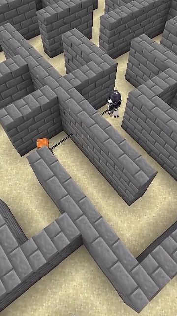 石壁の迷路で別の通路にいる二人の間を鎖がつないでいる場面
