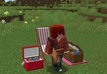 赤い服の山田さんがマイクラ世界の椅子と道具のそばに立つ場面